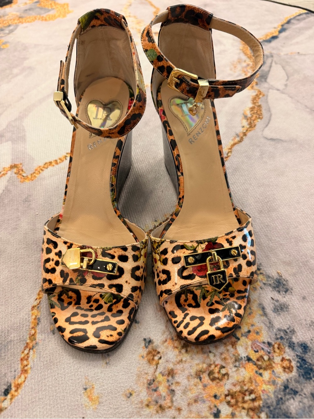 Ilasio Renzoni, a luxury Italian footwear 
Leopard wedge sandals